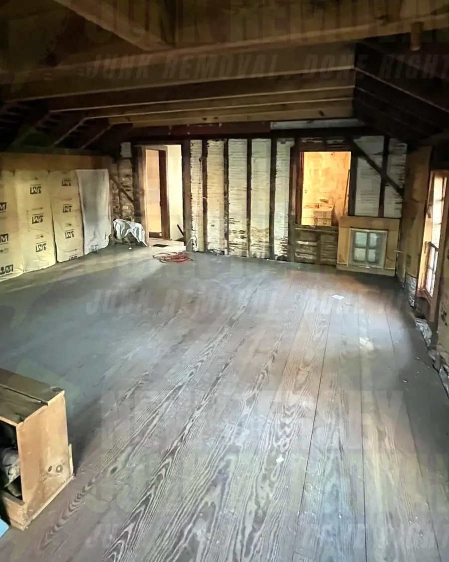 After: the same attic loft cleared and swept
