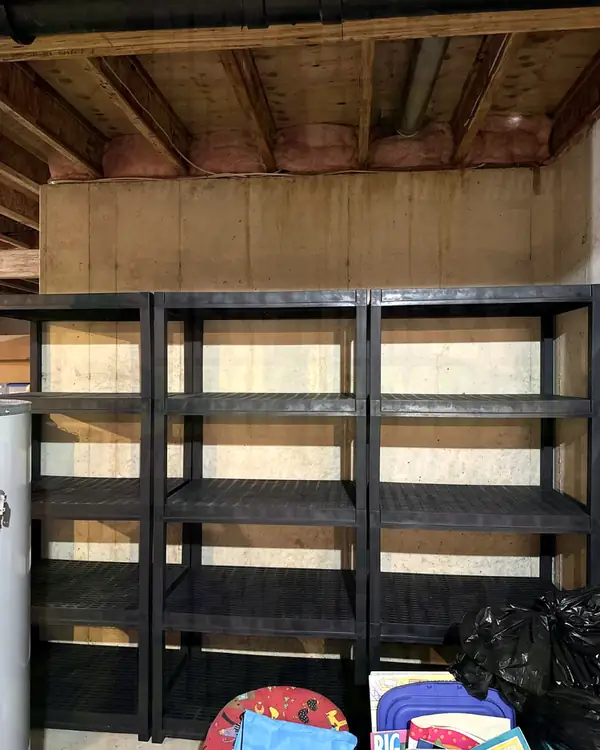 After: the same basement shelving units emptied