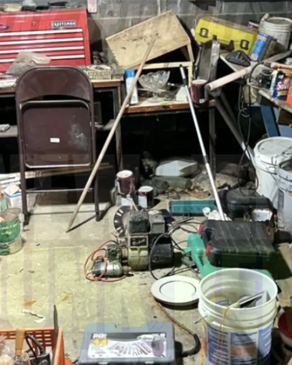 Before: a cinder-block basement workshop crowded with paint cans, buckets, tools and clutter