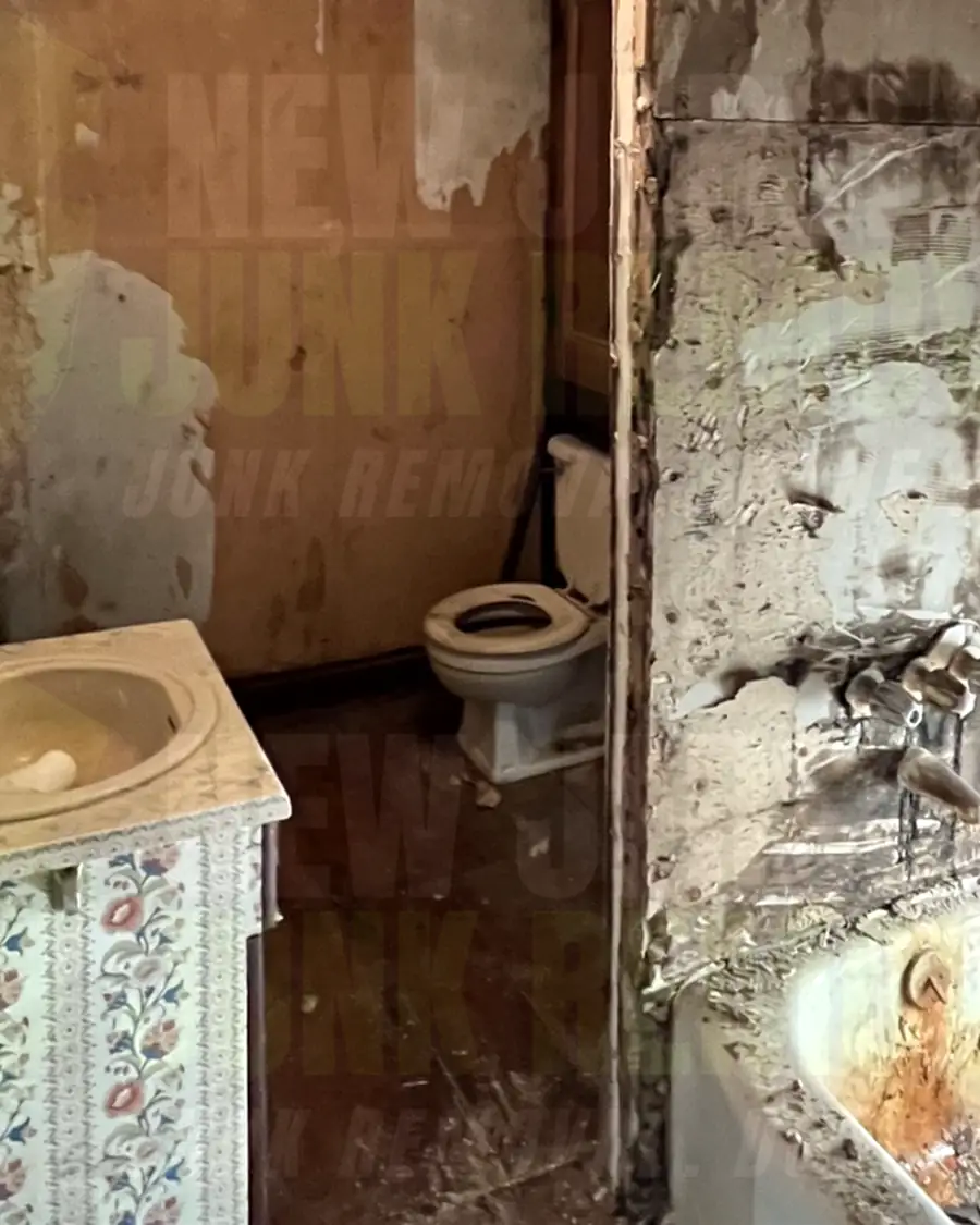 After: the same bathroom with the tub surround torn out down to the wall