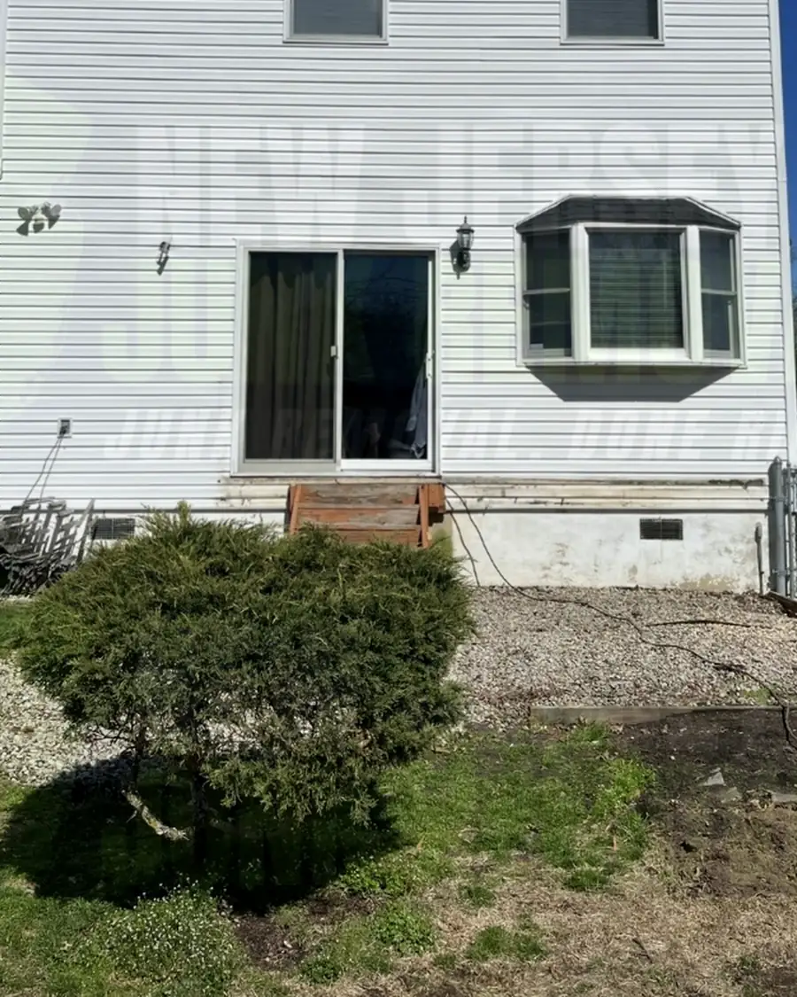 After: the same house with the deck removed