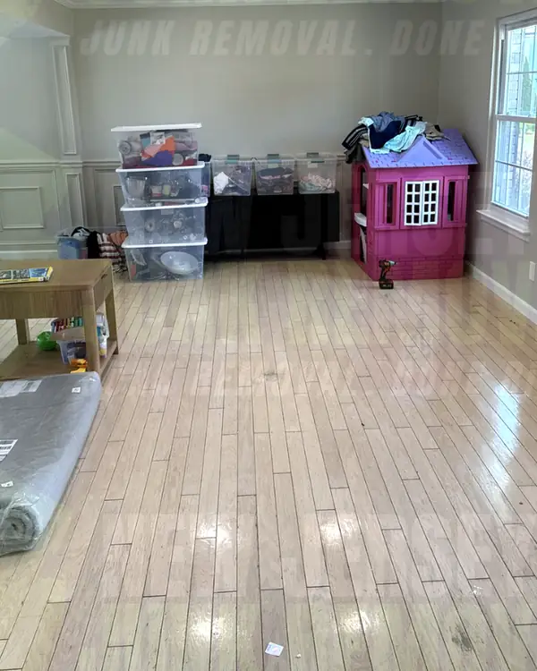 After: the same living area with the hutch and sofa gone