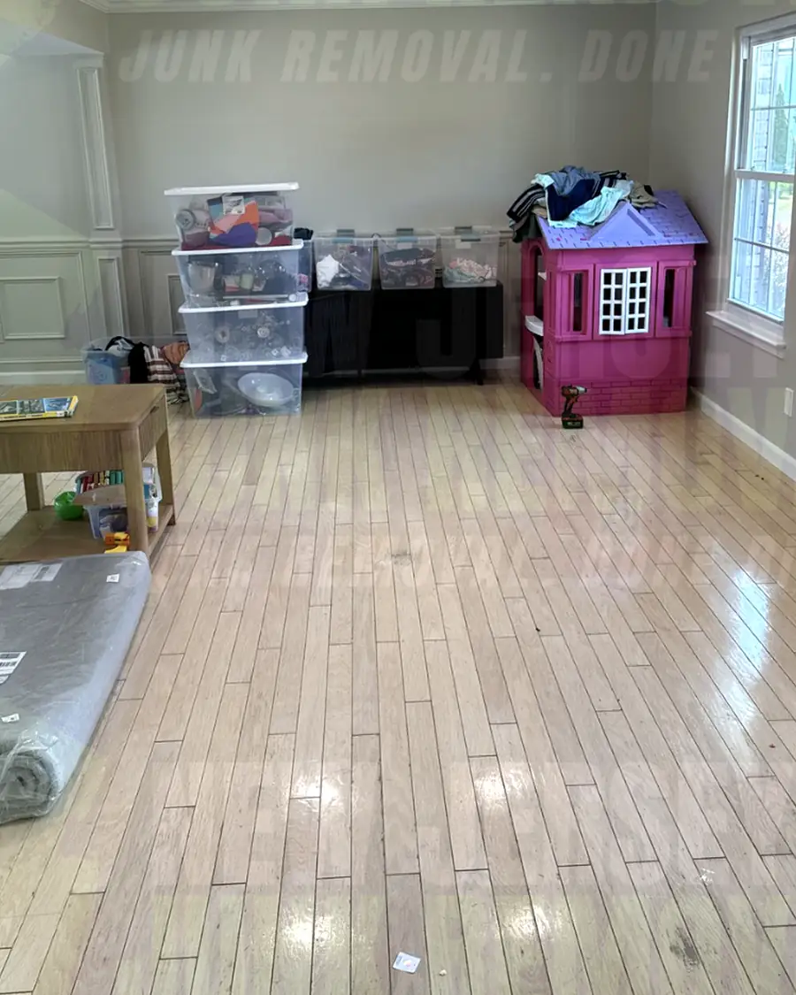 After: the same living area with the hutch and sofa gone