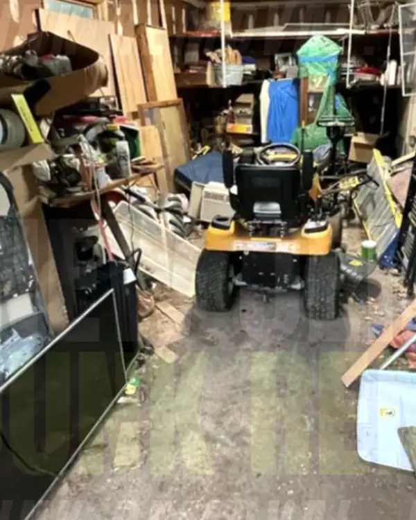 Before: a garage packed with a riding mower, an old TV, lumber and household clutter
