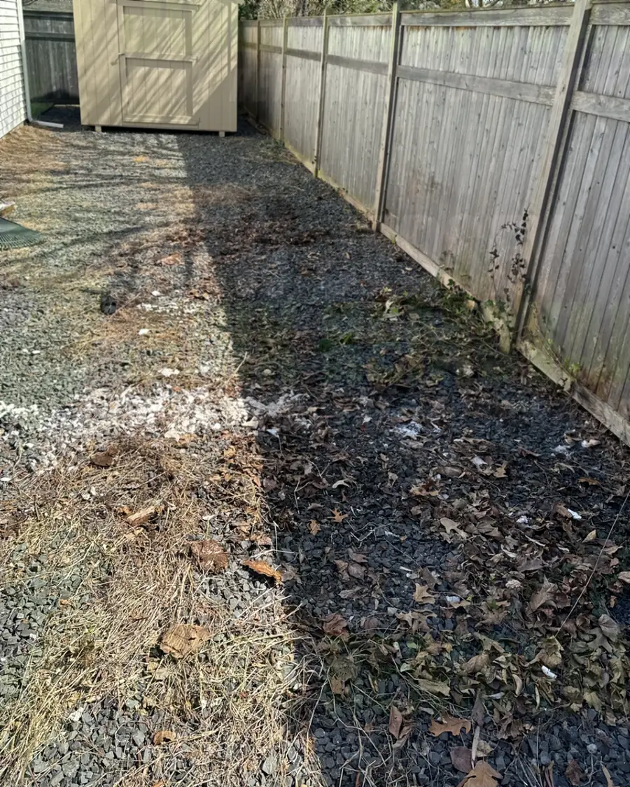After: the same side yard cleared to gravel